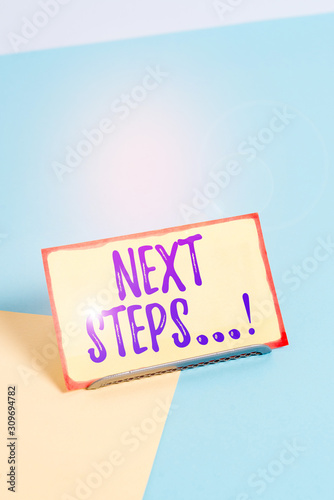 Text sign showing Next Steps. Business photo showcasing something you do after you have finished doing first one Paper placed tilted above buffer wire on soft pastel multi colours backdrop