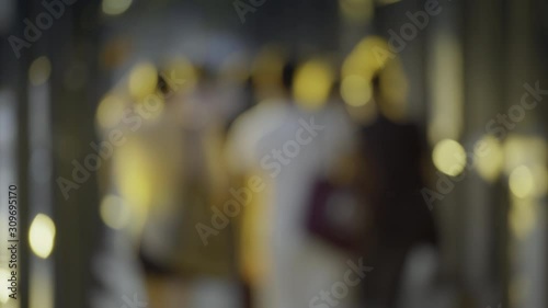 Wallpaper Mural Anonymous pedestrians passing a sidewalk corridor, slow motion of group of people walking, daylight  Torontodigital.ca