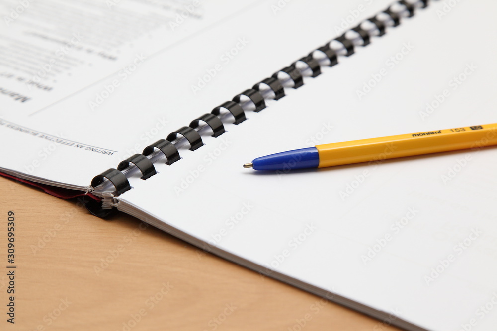 Business plan completed with pen and notebook Business plan completed with pen and notebook