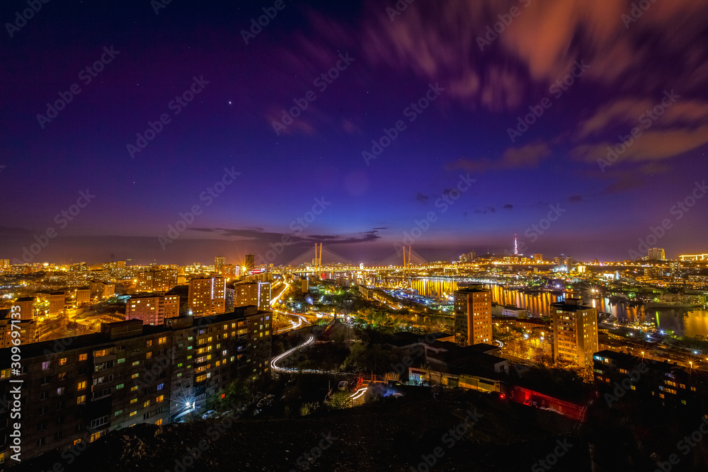 Panorama of the city of Vladivostok. Panoramic view of the Golden Horn and the central part of Vladivostok from one of the hills of the city at sunset time.