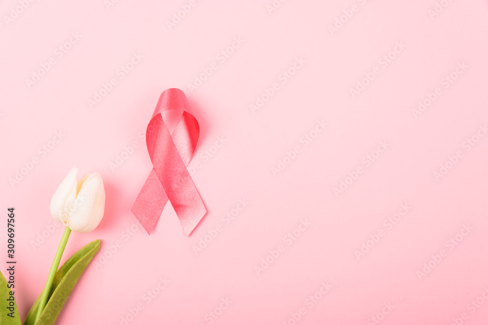 Breast cancer month concept, flat lay top view, pink ribbon and Tulip Flower
