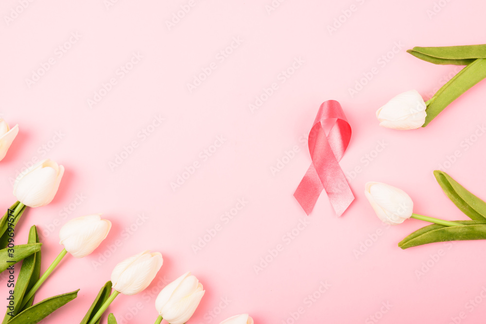 Fototapeta Breast cancer month concept, flat lay top view, pink ribbon and Tulip Flower