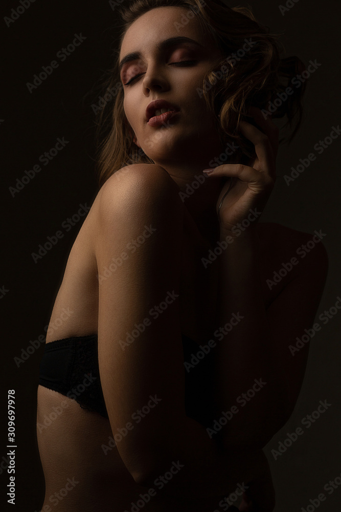 Pretty girl wears lingerie posing with closed eyes Pretty girl wears lingerie posing with closed eyes