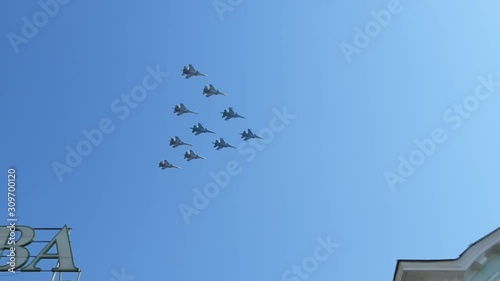 Aircrafts flying in blue may sky. Peaceful sky. World without war. photo