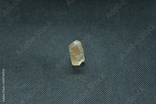 Fototapeta Naklejka Na Ścianę i Meble -  Natural quartz crystal on a black fabric background.	