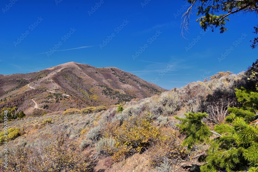 Butterfield canyon hiking path views of the Oquirrh range along the Wasatch Front Rocky Mountains, by Kennecott Rio Tinto Copper mine, Tooele and Salt Lake City fall. Utah, United States. Butterfield canyon hiking path views of the Oquirrh range along the Wasatch Front Rocky Mountains, by Kennecott Rio Tinto Copper mine, Tooele and Salt Lake City fall. Utah, United States.