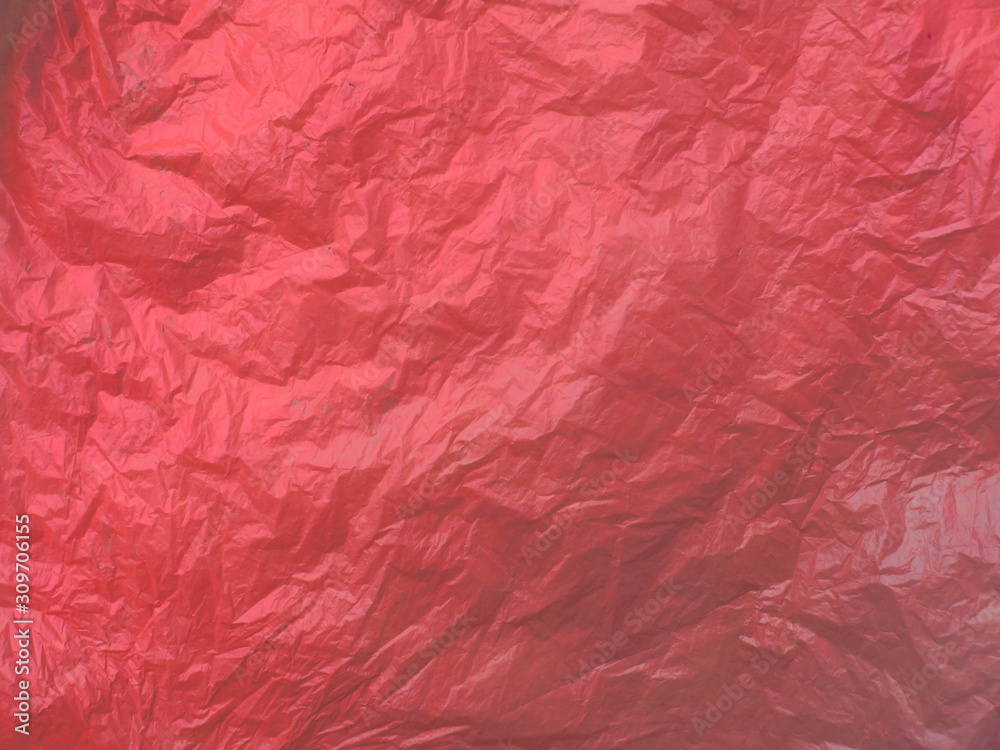 Plastic bag texture, red color background, close up Plastic bag texture, red color background, close up