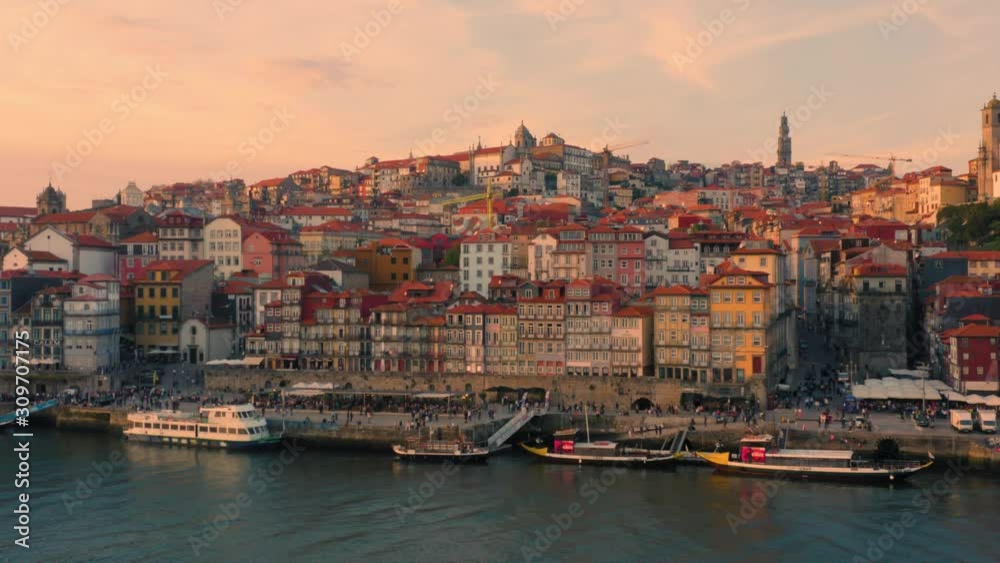 Porto, Portugal. Aerial view of the old city with promenade of the Douro river at sunset Porto, Portugal. Aerial view of the old city with promenade of the Douro river at sunset