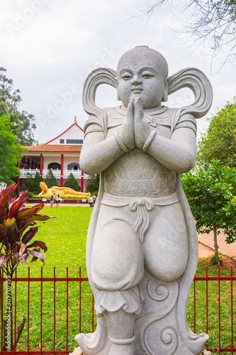 Foz do Iguacu, Brazil - Circa October 2019: Buddha child Sudhana (aka Shancai Tongzi) statue at Chen Tien Buddhist Temple photo