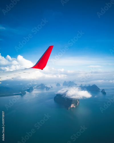 The aircraft descending before landing airport of Phuket, Thailand