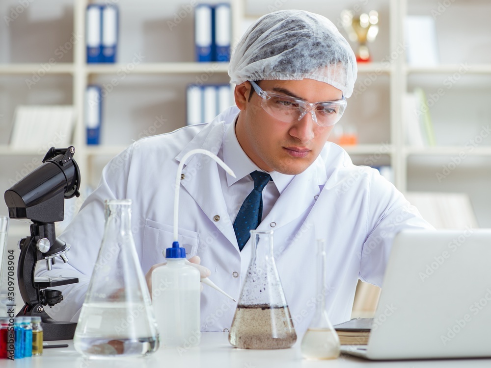 Young researcher scientist doing a water test contamination expe Young researcher scientist doing a water test contamination expe