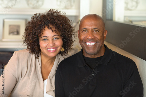 Portrait of a mature mixed race couple smiling.