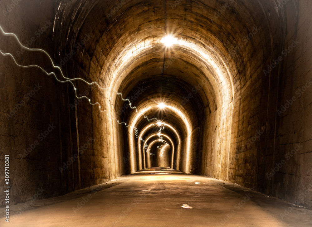 illuminated train track tunnel turned into greenway in alcoy