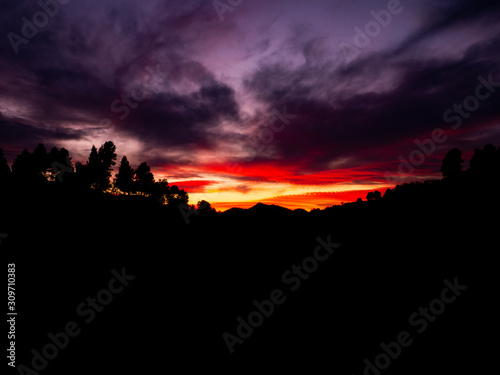 mountains silhouettes with purple and orange sky