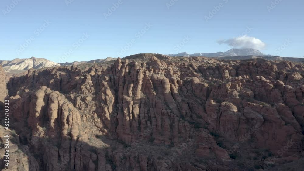 Aerial Drone view of Snow Canyon State Park and Red Cliff National Conservation Area in St George Utah on a bright sunny winter day showing red mountains Aerial Drone view of Snow Canyon State Park and Red Cliff National Conservation Area in St George Utah on a bright sunny winter day showing red mountains