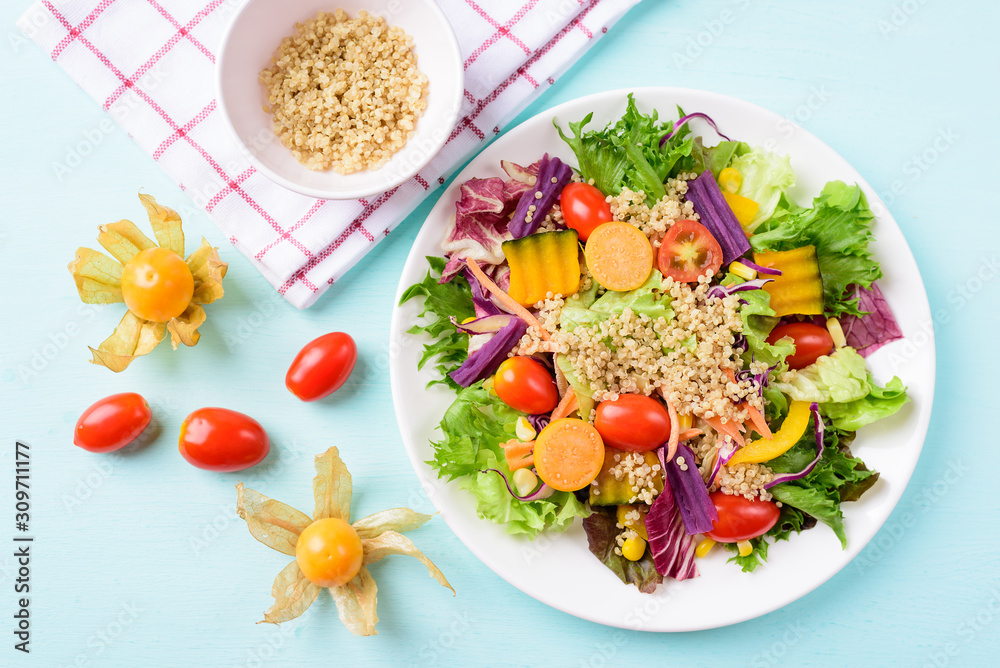 Healthy vegetables salad with quinoa seed and cape gooseberry fruit Healthy vegetables salad with quinoa seed and cape gooseberry fruit