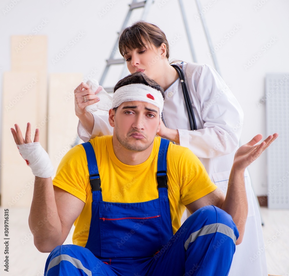Worker with injured head and doctor Worker with injured head and doctor