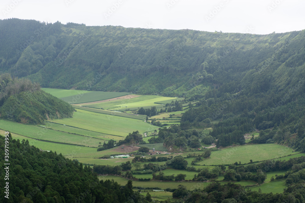 view of mountains, valleys, fields, and lakes in the Azores