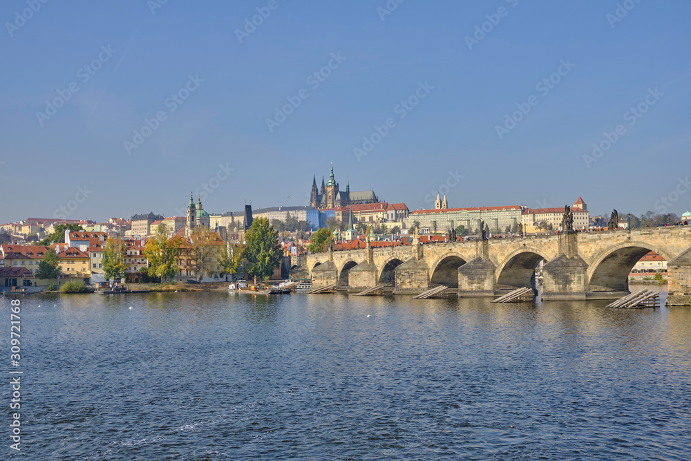 Scenic panorama with Prague Castle (Prazsky hrad), Charles bridge (Karluv most) and Vlatva river in capital of Czech Republic Prague. Beautiful summer sunny cityscape of the biggest city of Czechia