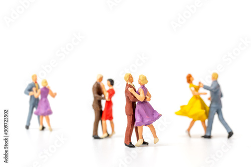 Miniature people   Couple dancing on white  background