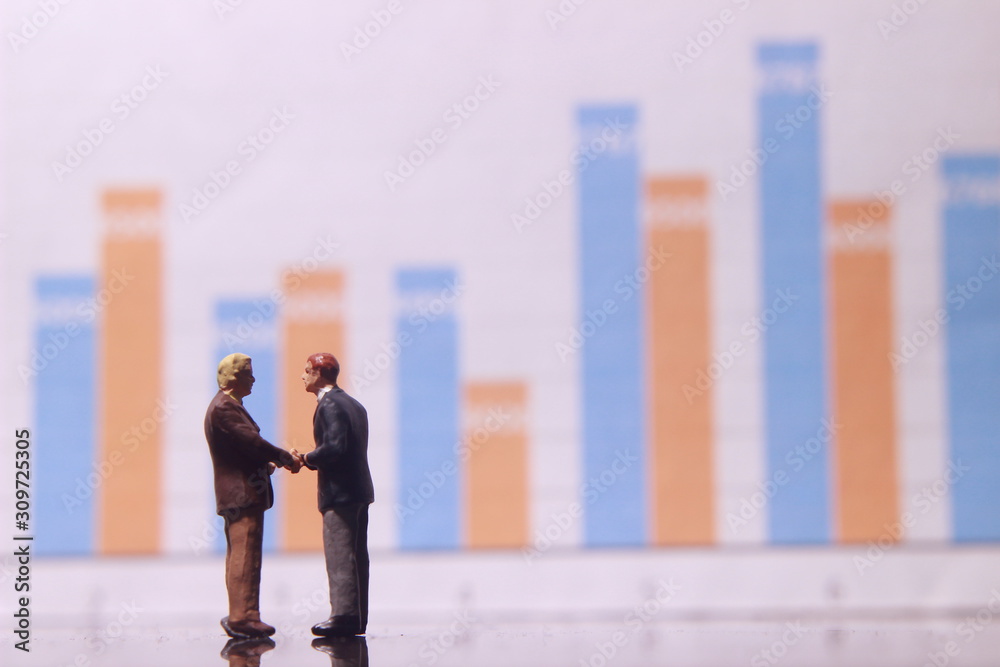 Simple Illustration Photo for Silhouette Two Man Handshaking and Business Agreement with graphic Chart as a background
