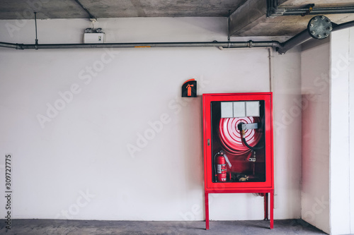 fire alarm switch on wall. Electrical Conduit & PVC Conduit. Closed-up of Fire alarm