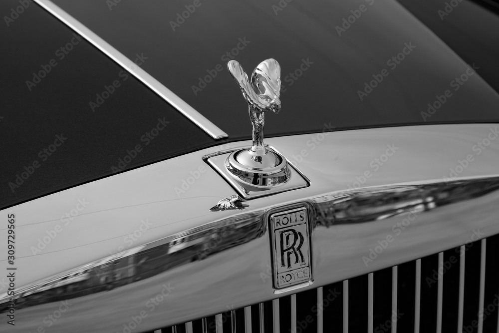 Front view of emblem Spirit of Ecstasy of new a very expensive Rolls Royce  Phantom car, a long black limousine, model outdoors on parking Stock Photo  | Adobe Stock