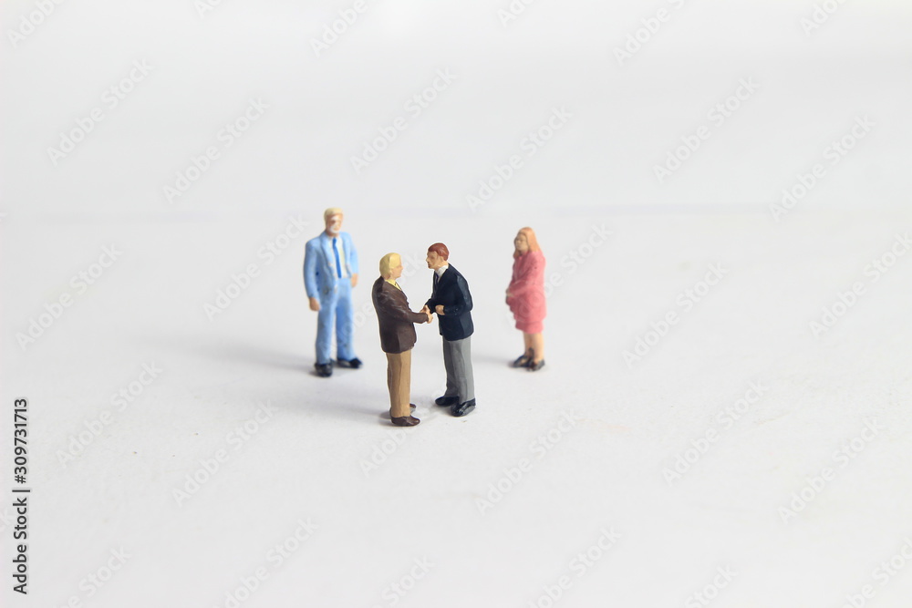 Gray Backgrond, Simple Illustration Photo for Mini Figure Two Man Toy Handshaking for Business Agreement Beyond their partner Gray Backgrond, Simple Illustration Photo for Mini Figure Two Man Toy Handshaking for Business Agreement Beyond their partner