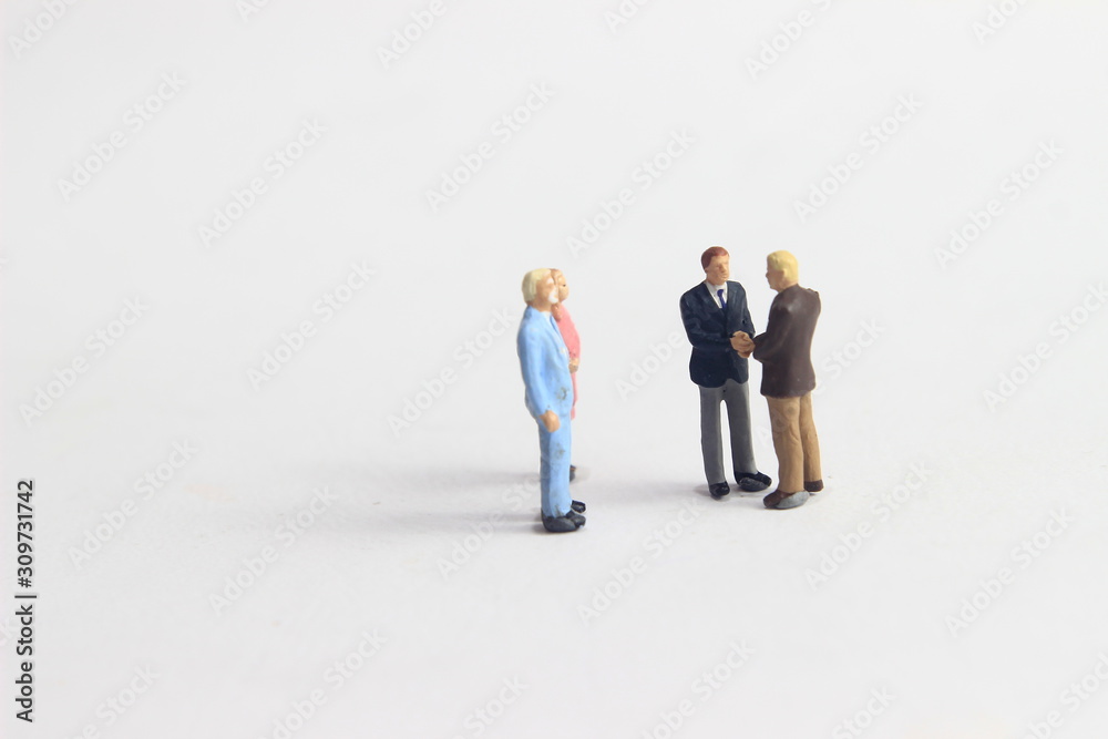 Gray Backgrond, Simple Illustration Photo for Mini Figure Two Man Toy Handshaking for Business Agreement Beyond their partner Gray Backgrond, Simple Illustration Photo for Mini Figure Two Man Toy Handshaking for Business Agreement Beyond their partner