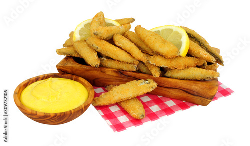 Fried bread crumb covered whitebait fish with mayonnaise dip in an olive wood dish isolated on a white background