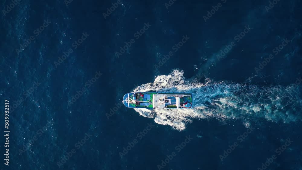 Top view of a fishing boat sailing in the Atlantic Ocean