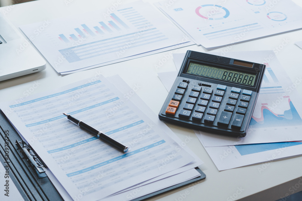 businessman working calculate data document graph chart report marketing research development planning management strategy analysis financial accounting. Business office concept. businessman working calculate data document graph chart report marketing research development planning management strategy analysis financial accounting. Business office concept.