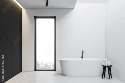 White and gray loft bathroom interior with tub