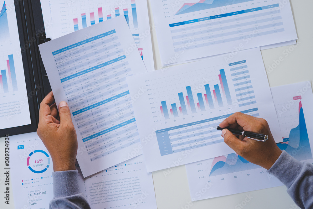 businessman working calculate data document graph chart report marketing research development planning management strategy analysis financial accounting. Business office concept. businessman working calculate data document graph chart report marketing research development planning management strategy analysis financial accounting. Business office concept.