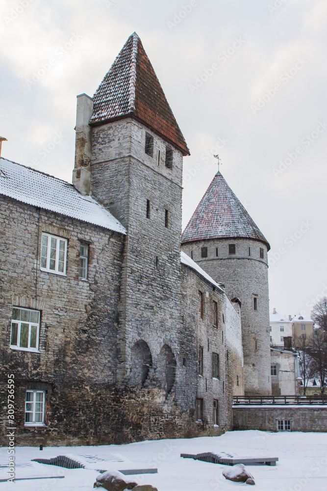 Obraz premium Historic defense towers in Old Town of Tallin in winter. Estonia