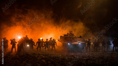Military patrol car on sunset background. Army war concept. Silhouette of armored vehicle with soldiers ready to attack. Artwork decoration. Selective focus © zef art