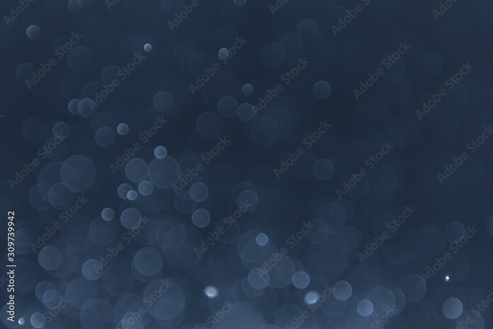 abstract sparkle bokeh light effect with navy blue background abstract sparkle bokeh light effect with navy blue background