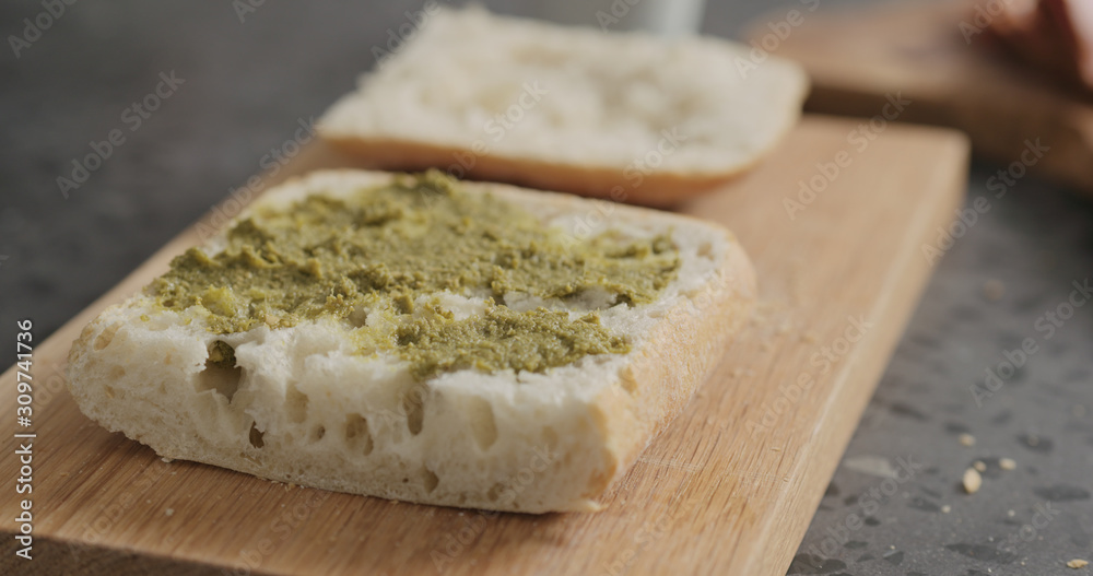 pesto on ciabatta slice on oak board pesto on ciabatta slice on oak board