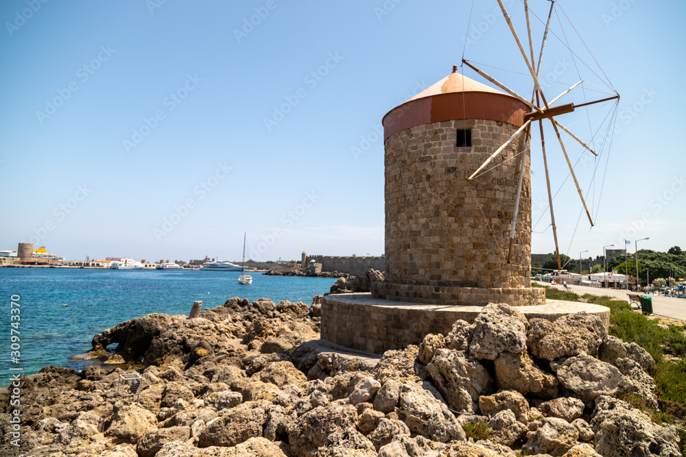 Old windmill at Mandraki  harbour in Rhodes city