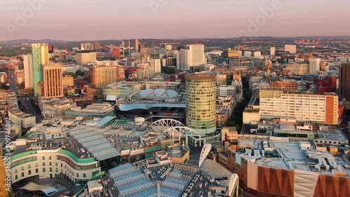 aerial shot drone of birmingham city centre at sunrise flying backwards rising up england uk photo