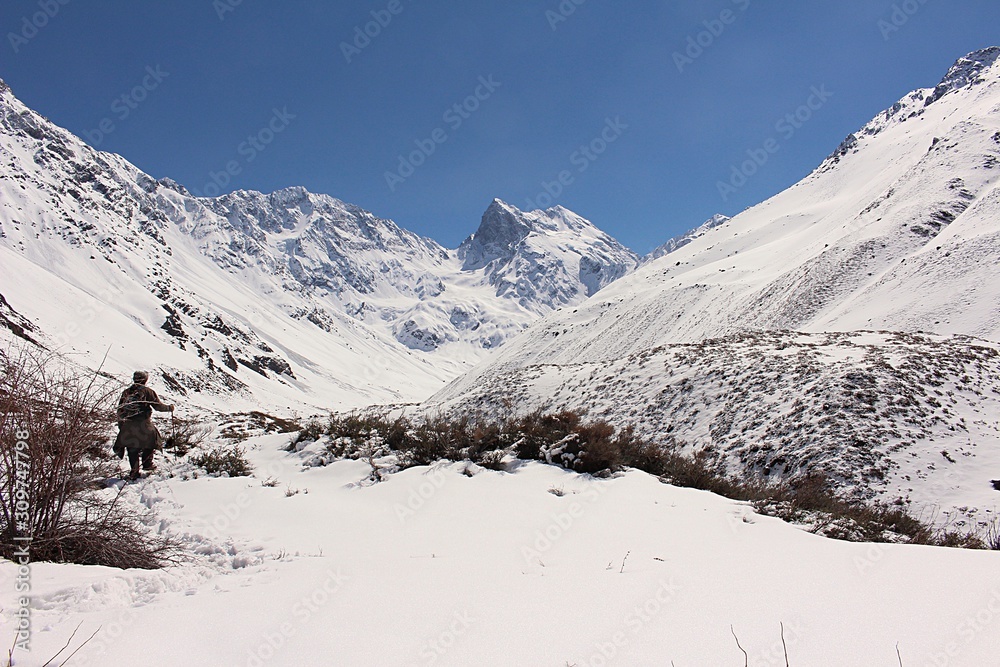 Valley among snowy mountains in Cajón del Maipo, central Andes of Chile.