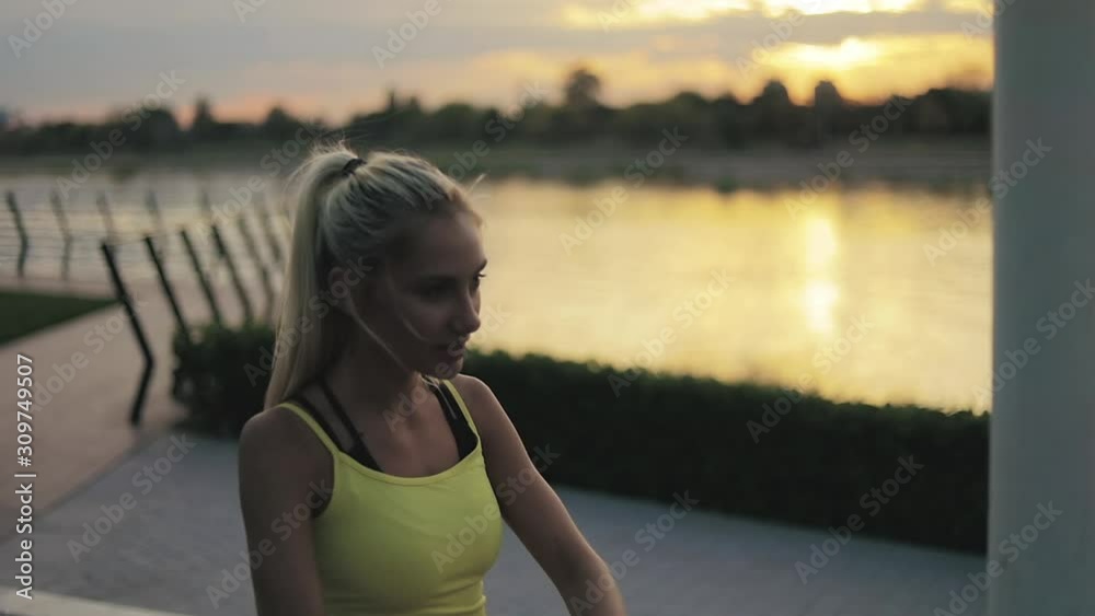 Woman stretching near the river in sunset / sunrise time. Woman stretching near the river in sunset / sunrise time.