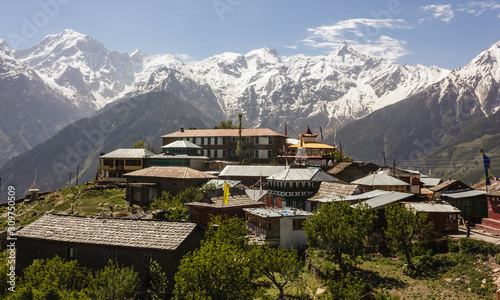 A view of the village of Kalpa surrounded by the Himalayan peaks of the Kinner Kailash range in Kinnaur, India. photo