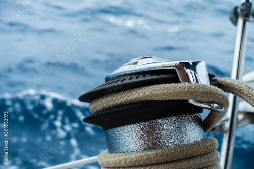 Winch and rope on yacht © Camille