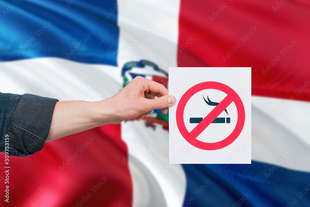 Dominican Republic health concept. Hand holding paper with no smoking
