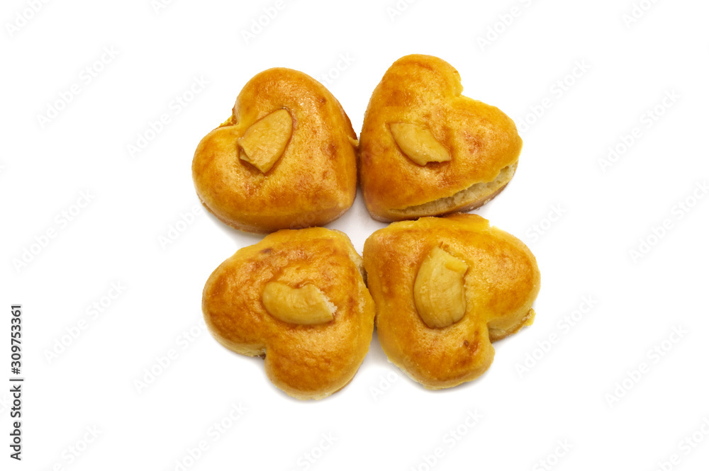 Cashew nut or Singapore cookies of heart shape isolated on white background for valentine's day or other celebration element concept design. Cashew nut or Singapore cookies of heart shape isolated on white background for valentine's day or other celebration element concept design.