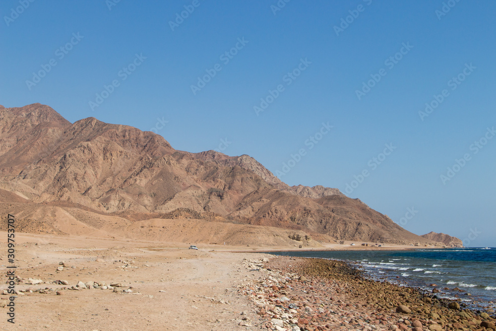 The coastline of the Red Sea and the mountains in the background. Egypt, the Sinai Peninsula. The coastline of the Red Sea and the mountains in the background. Egypt, the Sinai Peninsula.