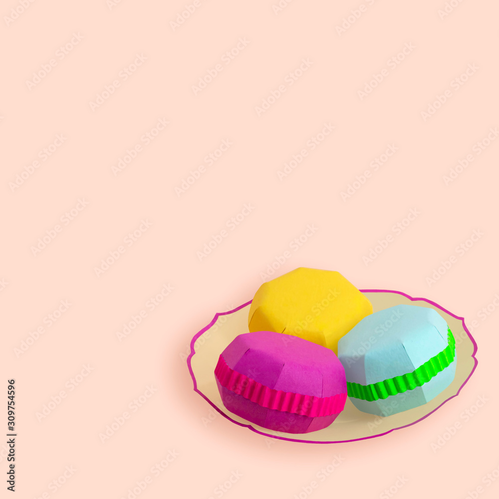 Multicolored paper macaroons on plate Multicolored paper macaroons on plate