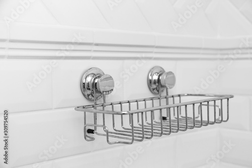 Suction cups compact bath shelf, fixing on tiled wall without drilling. photo