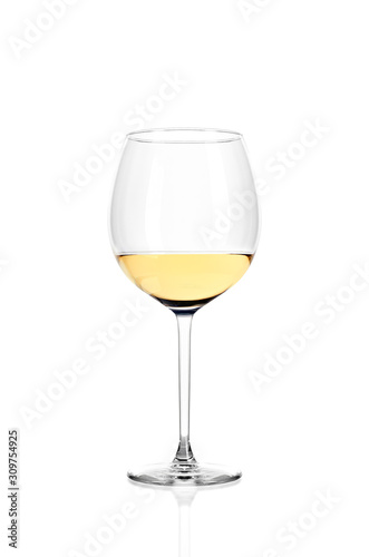 A glass of white wine half filled, isolated on a white background.